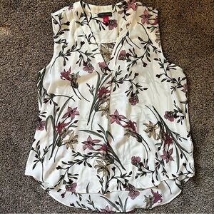 White/cream blouse with floral patterns